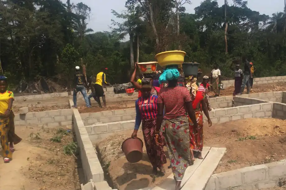Women transporting build materials